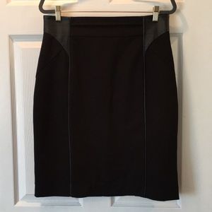 Knee length skirt with faux leather detail